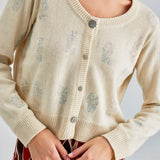 Daisy Cardigan Ivory featuring delicate embroidery and a serene ivory shade for a soft, sophisticated look
