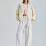 Chic ivory jacket with exquisite floral embroidery and wrist-length sleeves