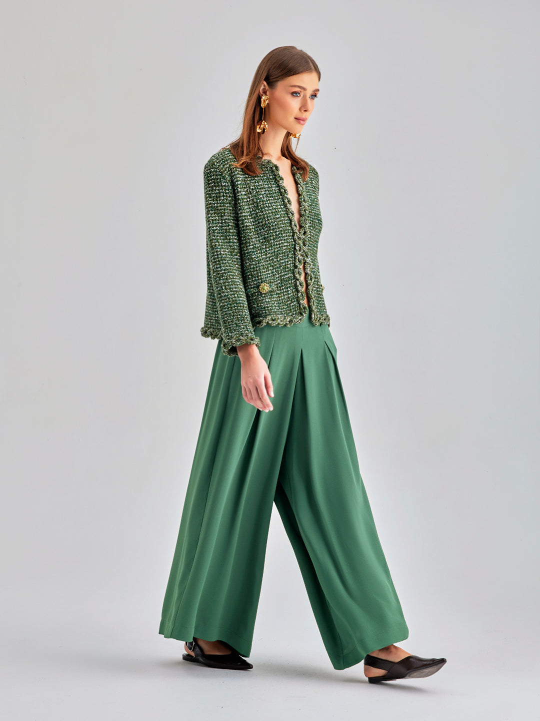 High-rise Gia Pants in green offering comfort and sophisticated style