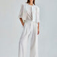 Elegant ivory trousers featuring a high waist and flowing wide-leg design