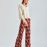 Versatile Daisy Cardigan Ivory with delicate details and a soft drape, perfect for layering over various outfits