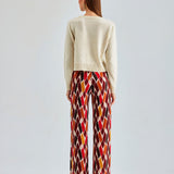 Chic Daisy Cardigan Ivory showcasing a lightweight fabric and intricate embroidery for a touch of grace