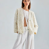 Statement-making ivory jacket with chic sleeves and elegant floral design