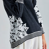 Romantic Leti Sweater with long sleeves and floral accents, perfect for adding a touch of charm to any outfit
