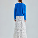 Daisy Cardigan Blue with a soft, draping fabric and delicate embroidery, enhancing any outfit with understated charm