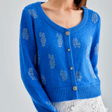 Daisy Cardigan Blue with a serene hue and delicate embroidery, offering a blend of comfort and classic style