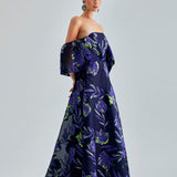 Zelene Gown Violet showcasing intricate floral detailing and a seductive open back design