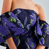 Majestic Zelene Gown in violet with dramatic low-cut shoulders and flowing silhouette
