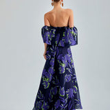 Zelene Gown Violet adorned with luxurious floral patterns and an open back for a sophisticated look