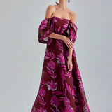 Dramatic Zelene Gown Red with intricate floral designs and a bold open back for evening events